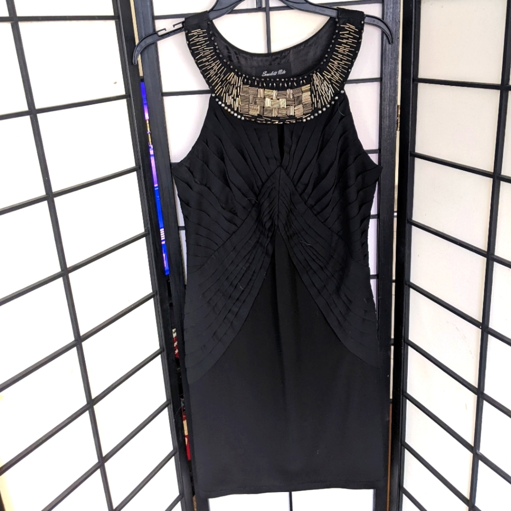 Black sheath dress with beaded collar